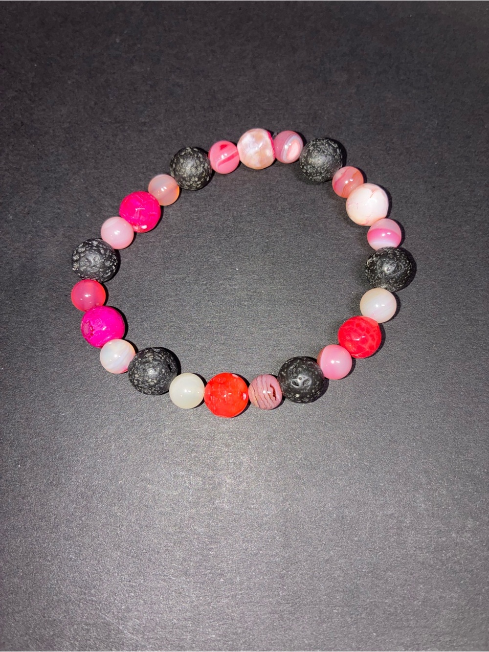 Pink agate and lava bead bracelet